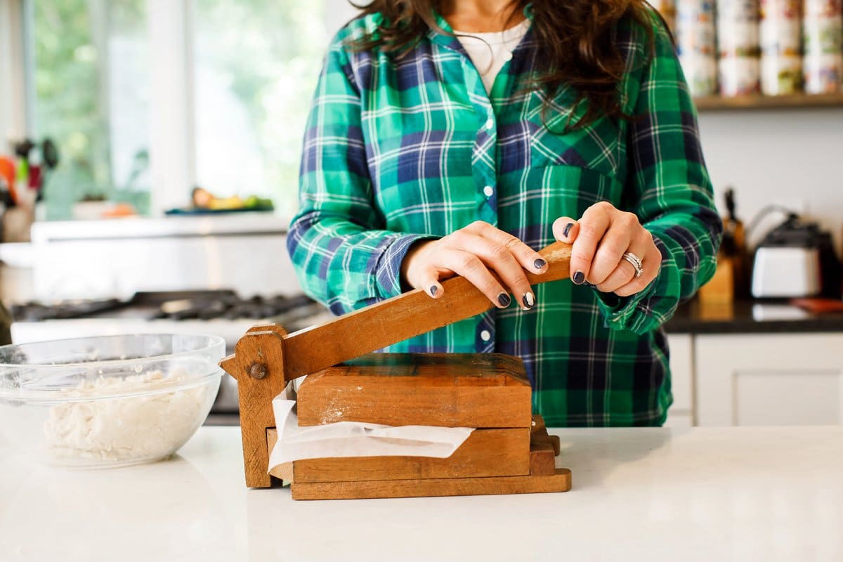 making homemade corn tortillas 