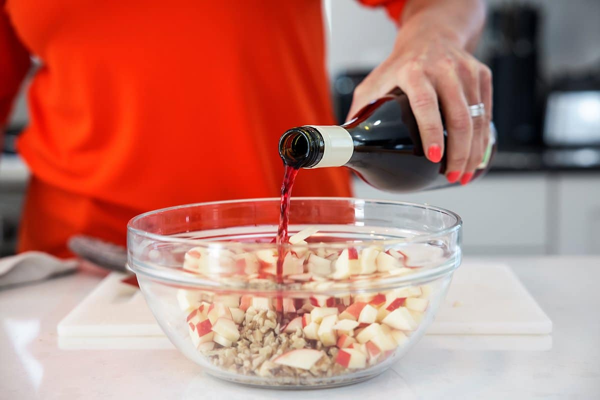 adding wine to charoset