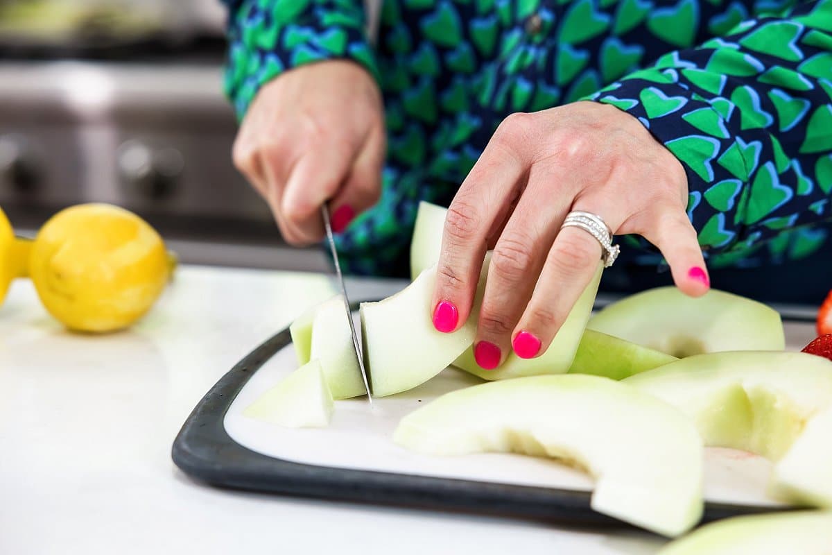 slicing honeydew melon