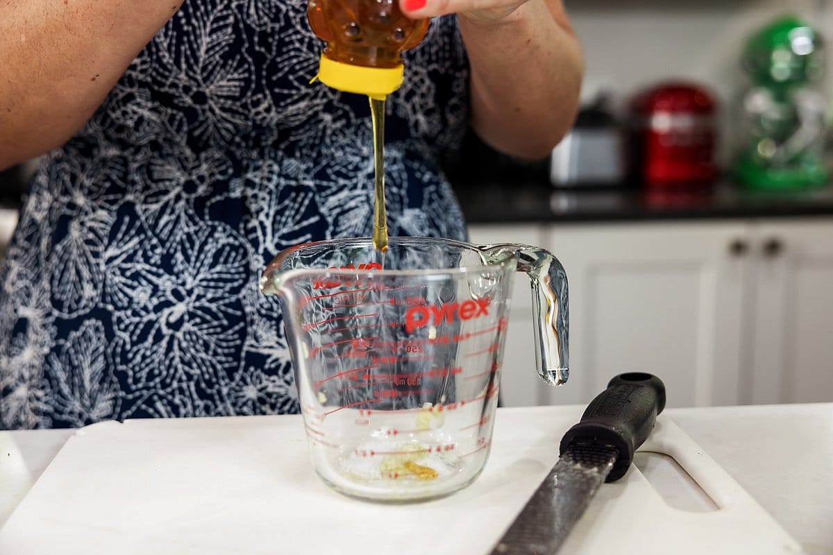 honey being added to a pyrex