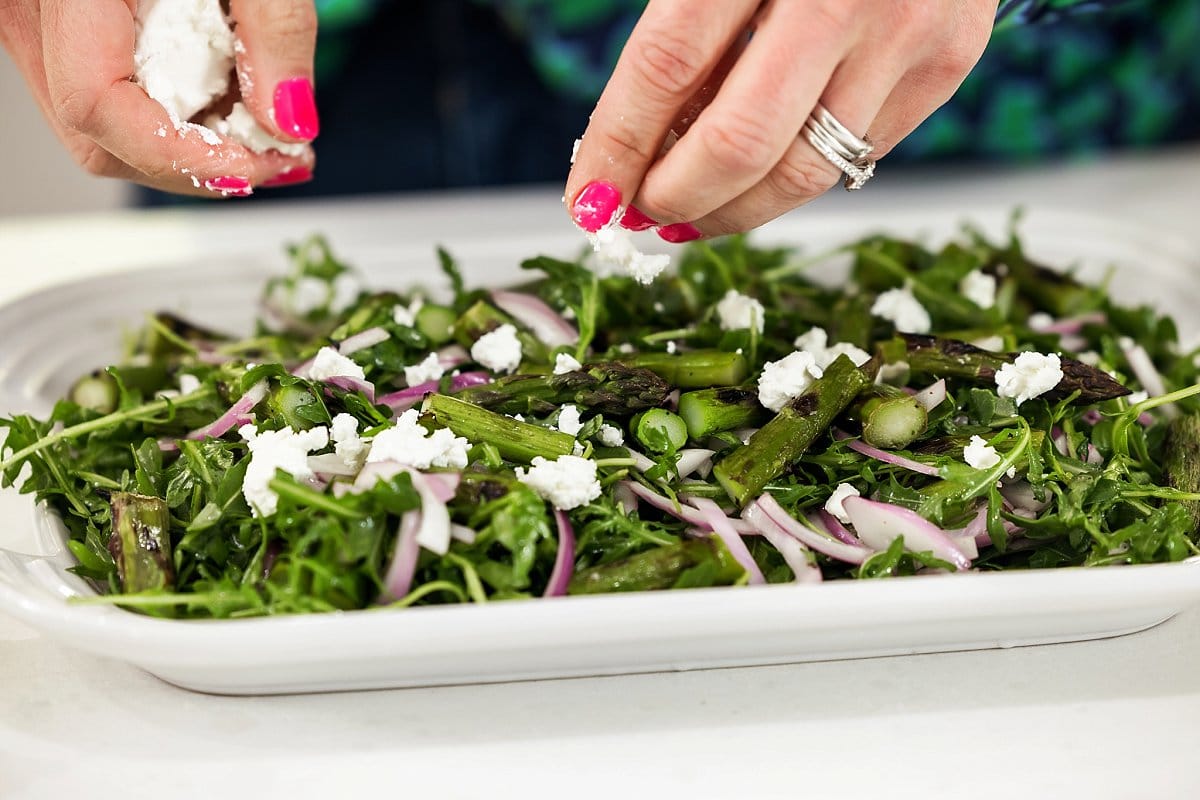 Scattering Goat Cheese on Asparagus Salad
