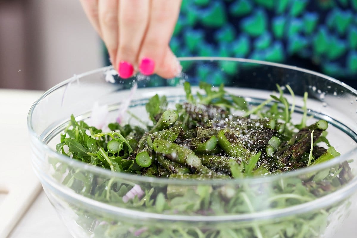 Seasoning Asparagus Salad with Salt and Pepper