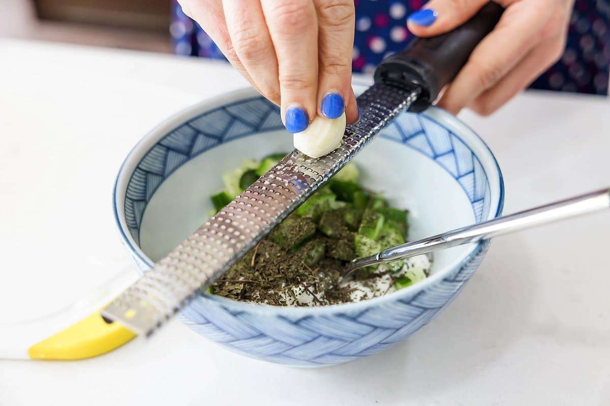 Adding garlic to cucumber yogurt sauce