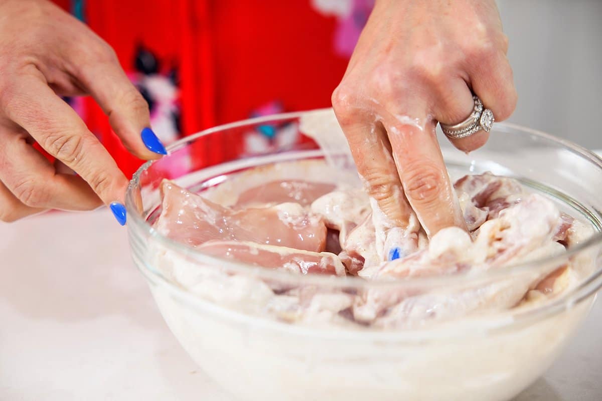 close up view of marinating raw chicken