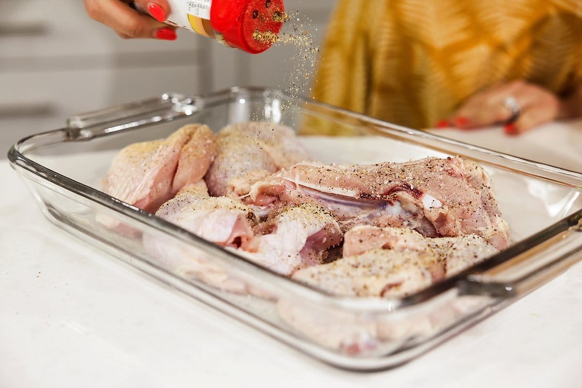 lemon pepper added to raw chicken pieces