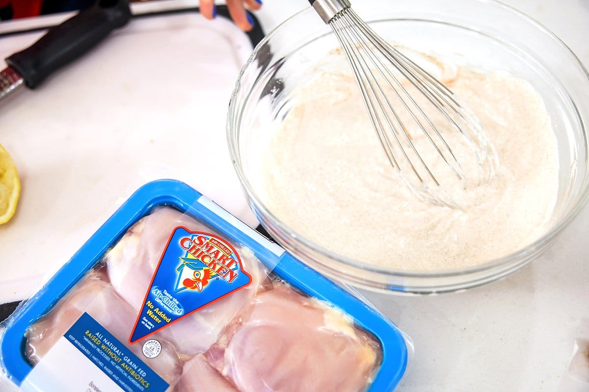 marinade for grilled chicken shawarma with a package of chicken on the side