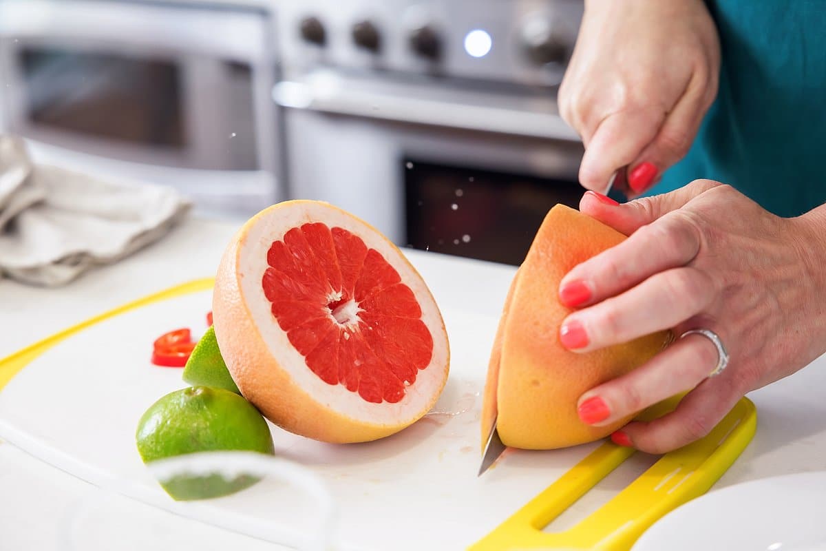 Liz cutting a grapefruit