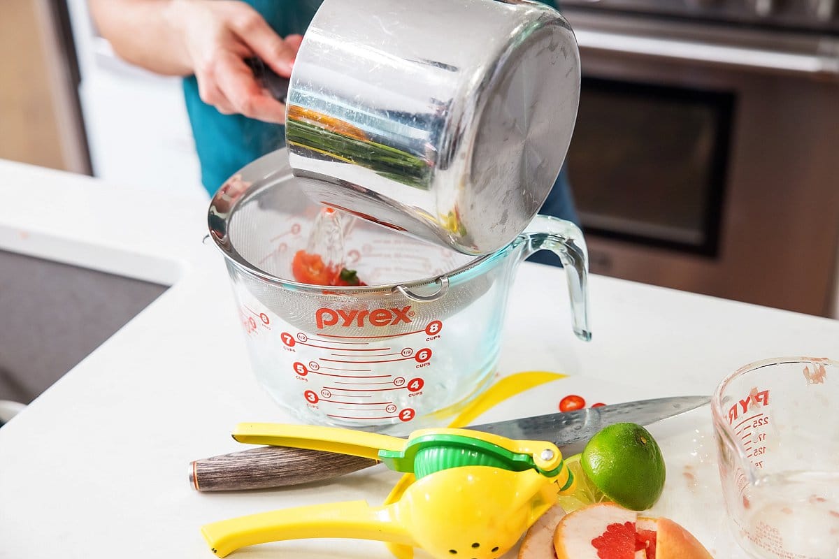 Straining the chilis in a strainer
