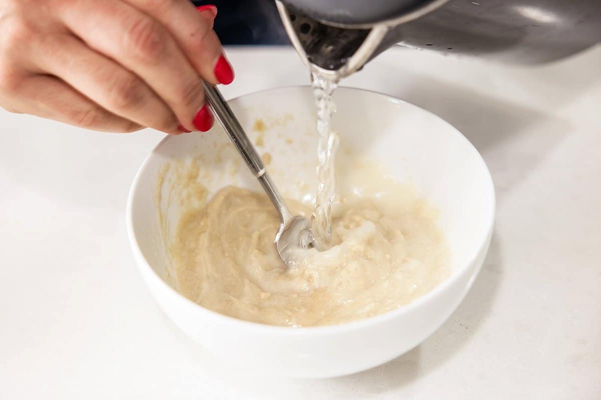 Liz finishing tahini sauce.