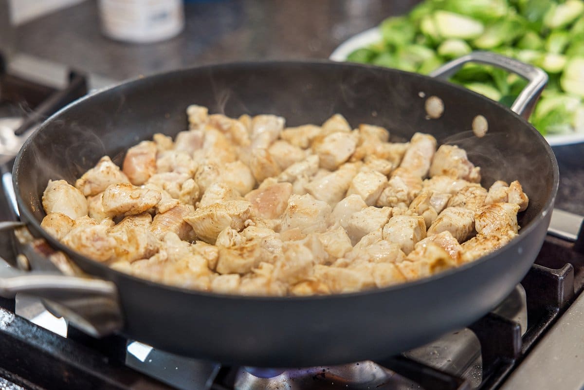A pan of food cooking on a stove