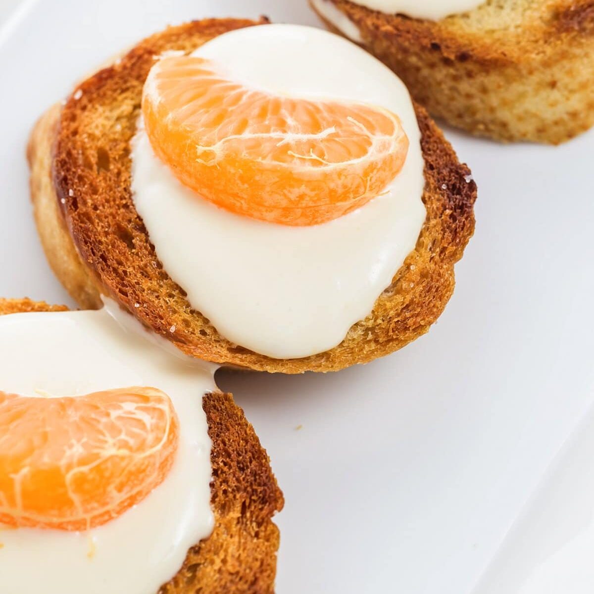 Crostini garnished with tangerine