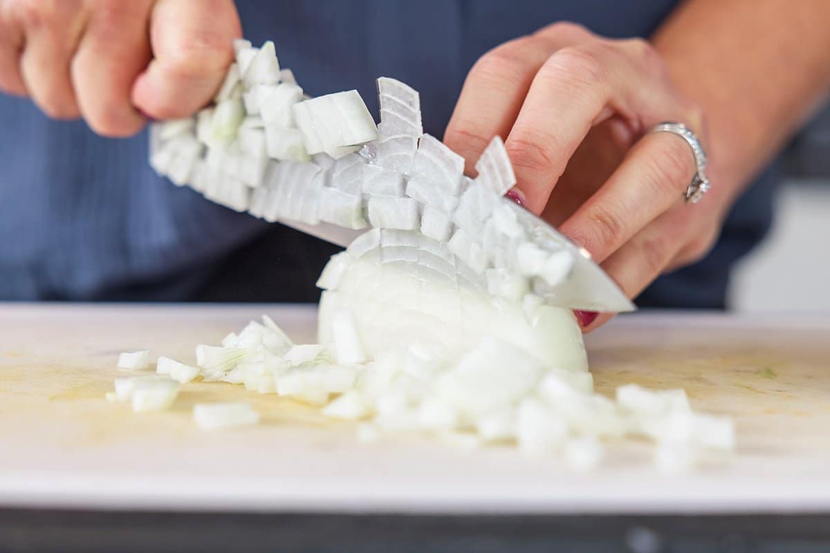 cutting onions on a cutting board