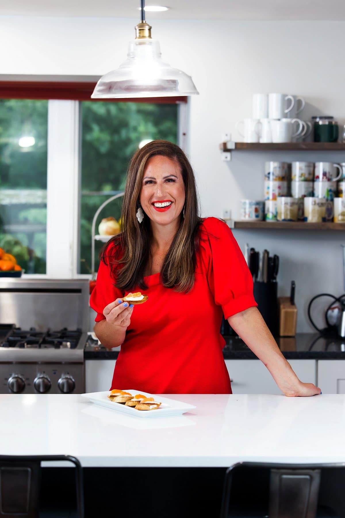 Liz enjoying honey tangerine goat cheese crostini.