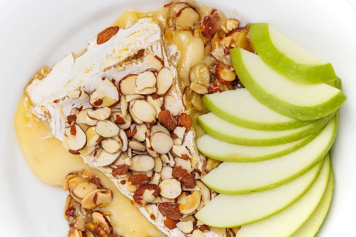 Baked brie with honey and almonds and apples.