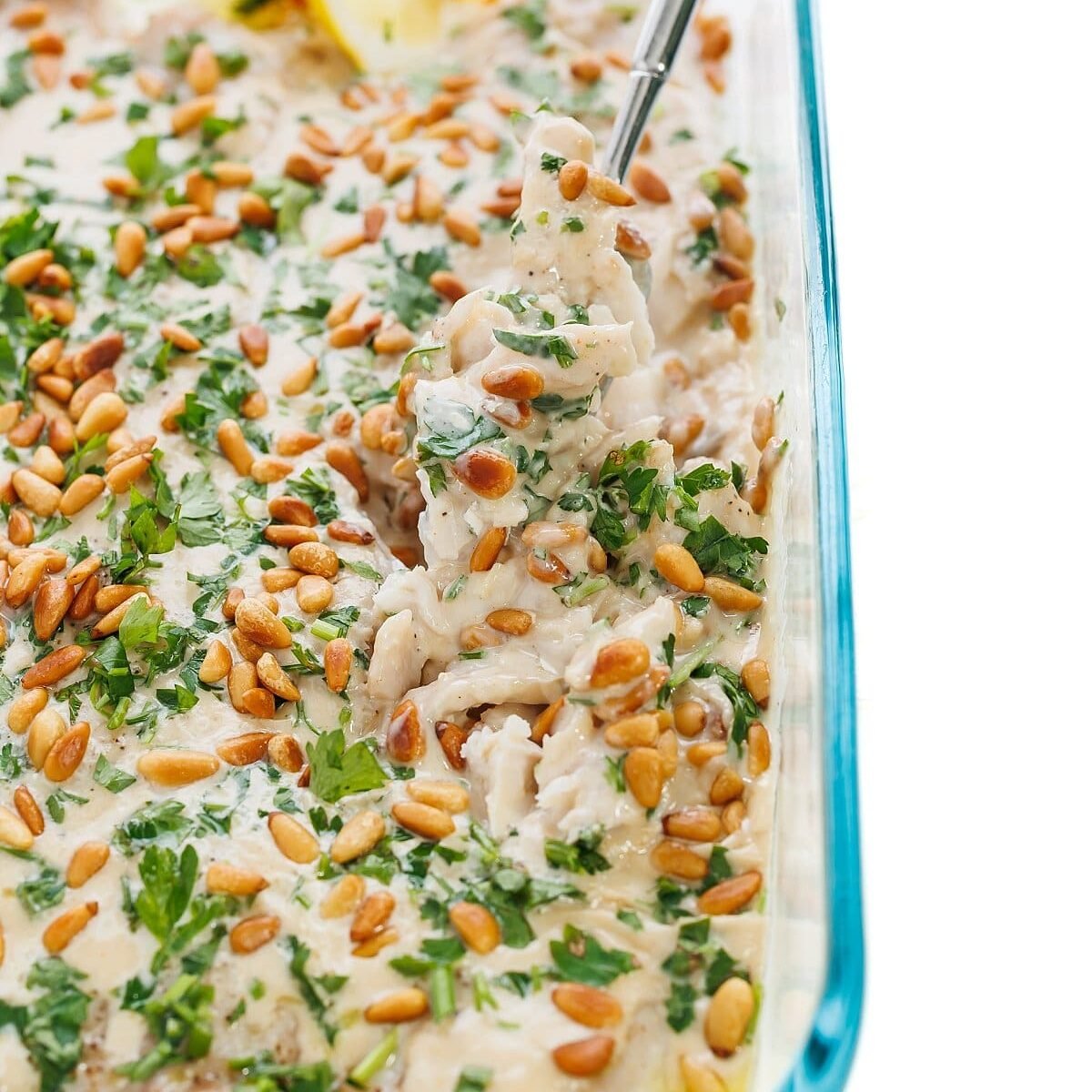 Lebanese Baked Fish with Tahini Sauce and Toasted Pine Nuts