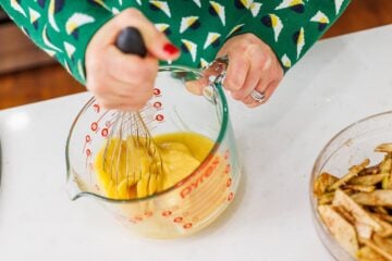 A person stirring ingredients