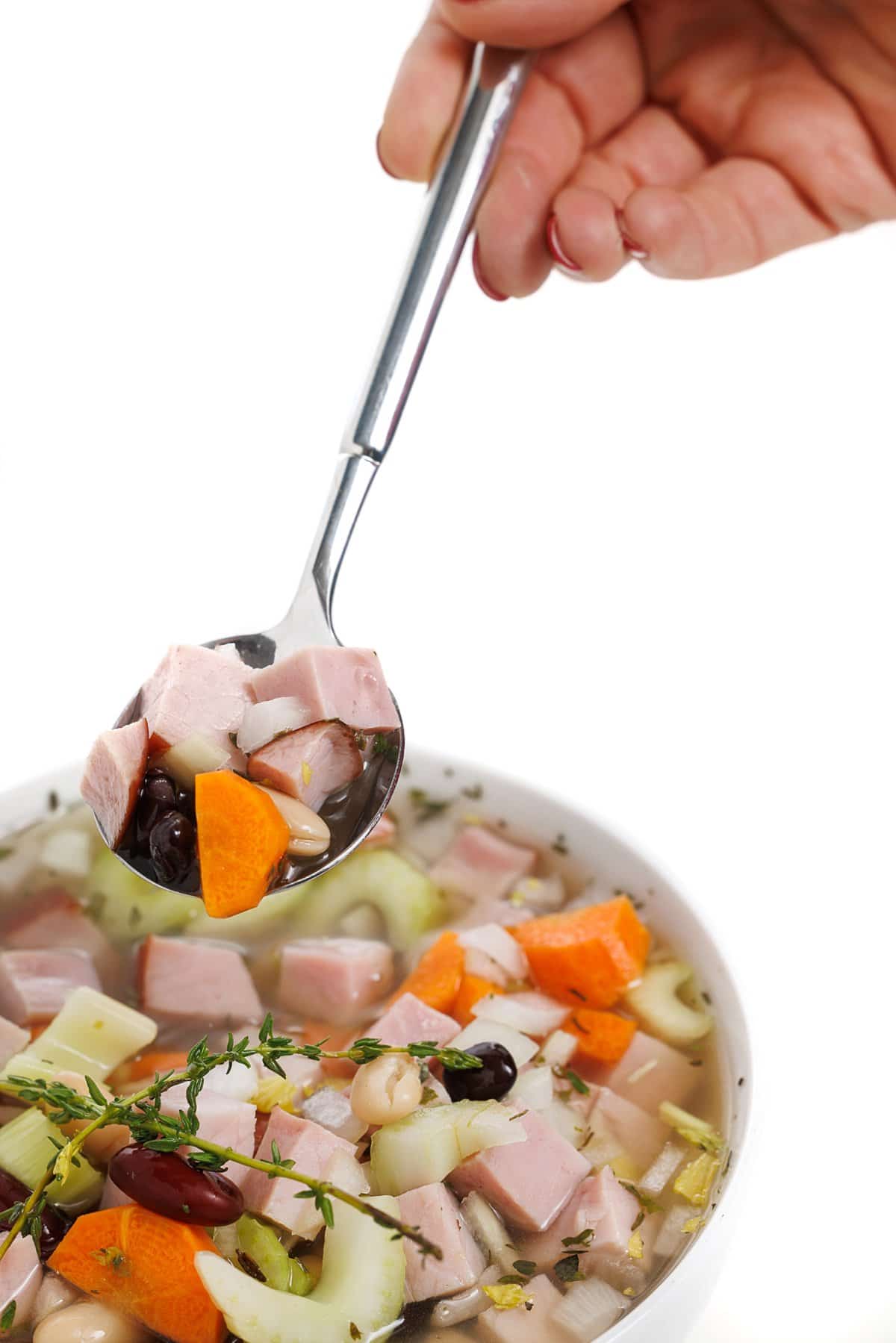 Spoonful of ham and bean soup.