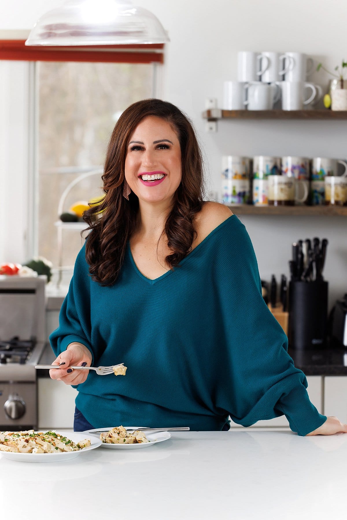 Liz eating Greek style baked chicken breasts.