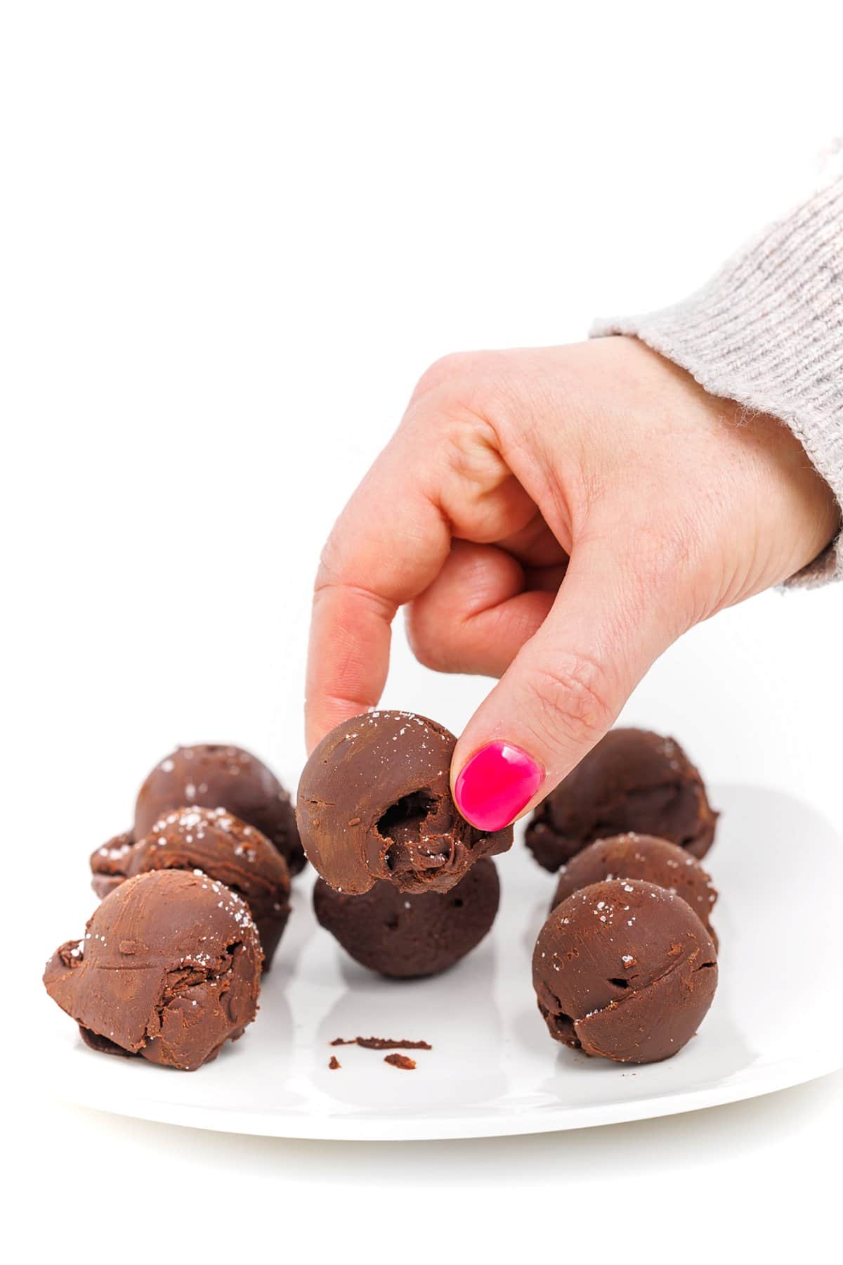 Grabbing a chocolate truffle with sea salt.