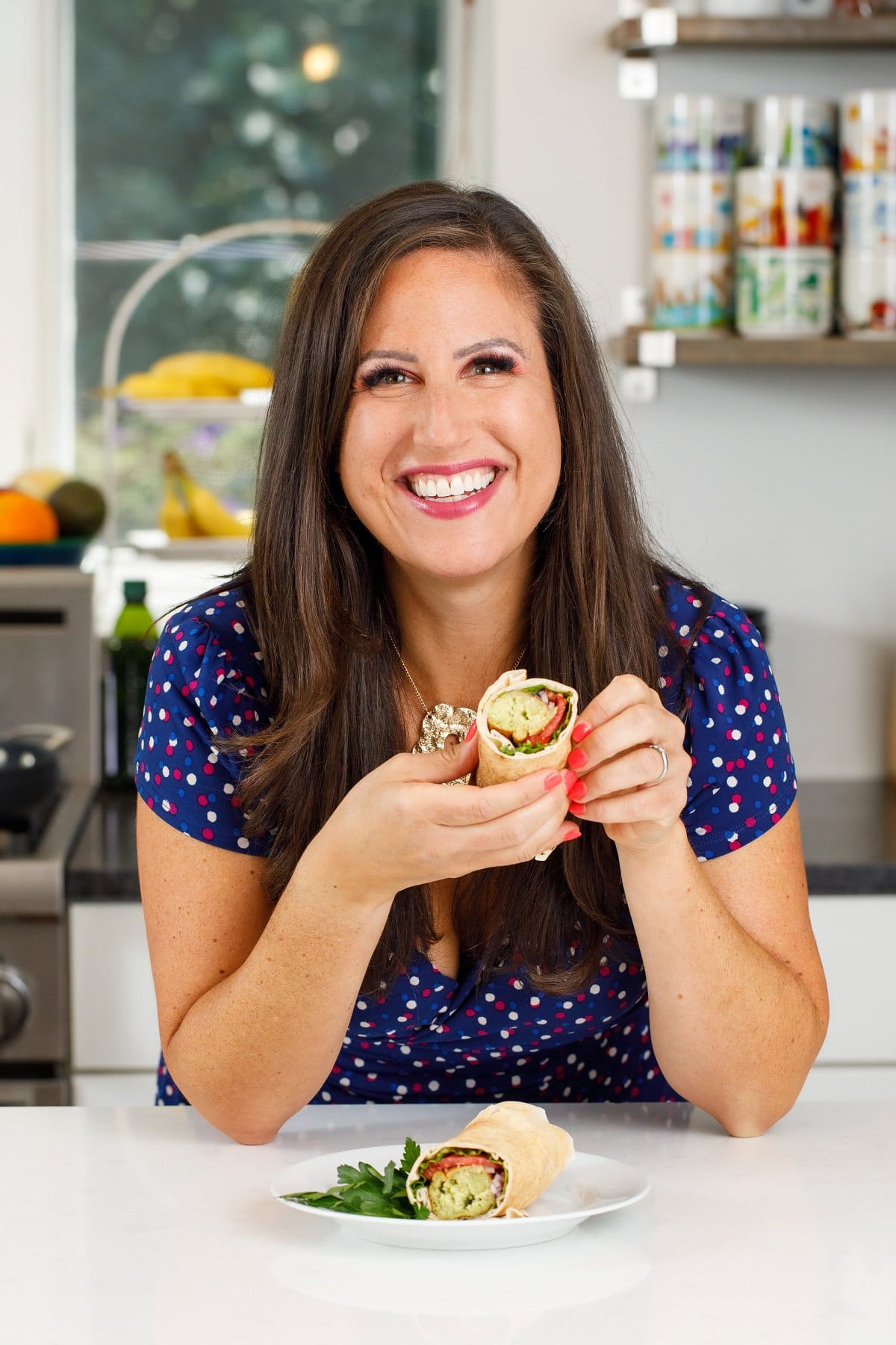 Liz eating an authentic Lebanese falafel wrap.