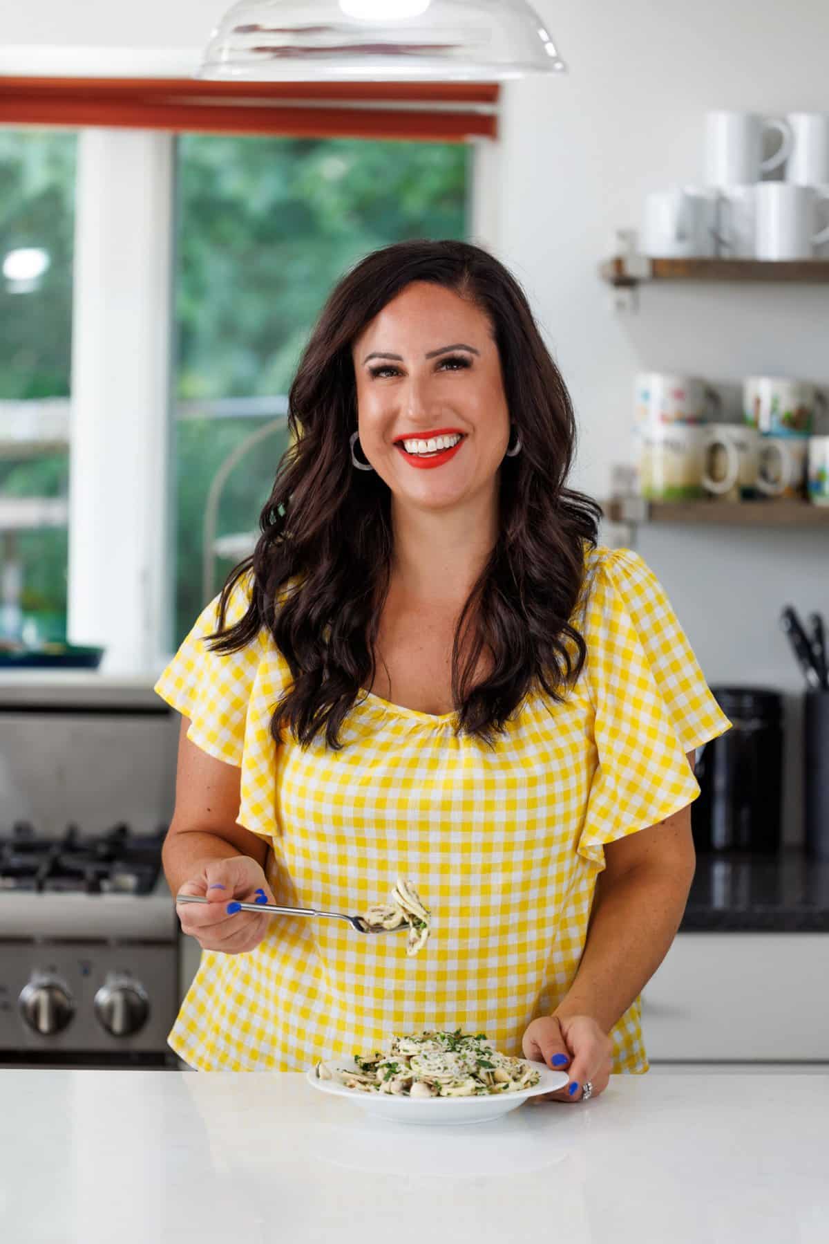 Liz eating fresh mushroom salad with lemon parmesan vinaigrette.