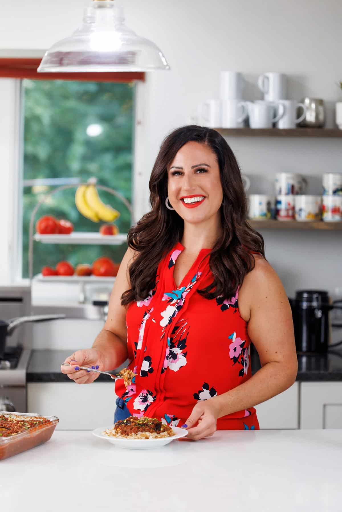 Liz eating Lebanese baked egplant with beef.