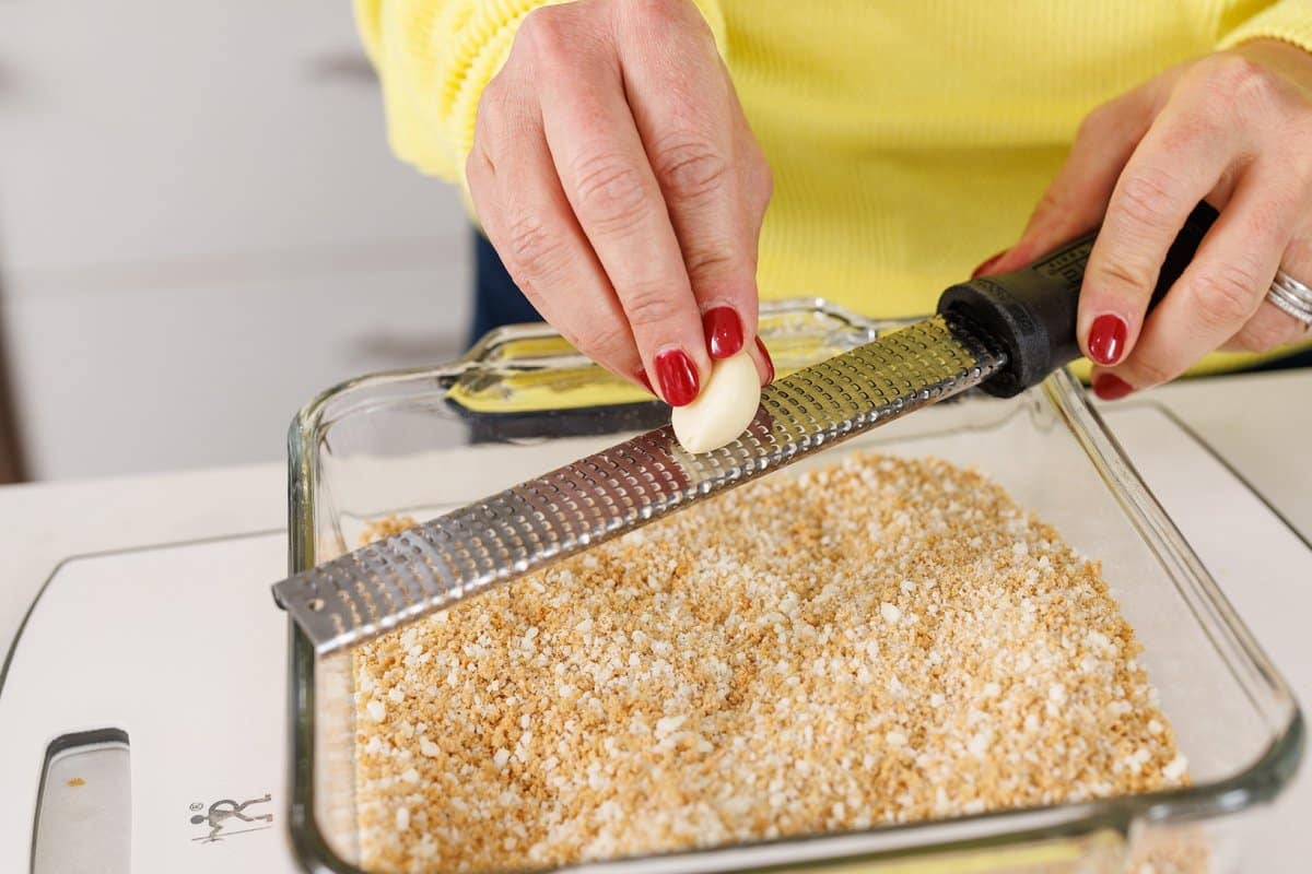 Grating garlic with a microplane.