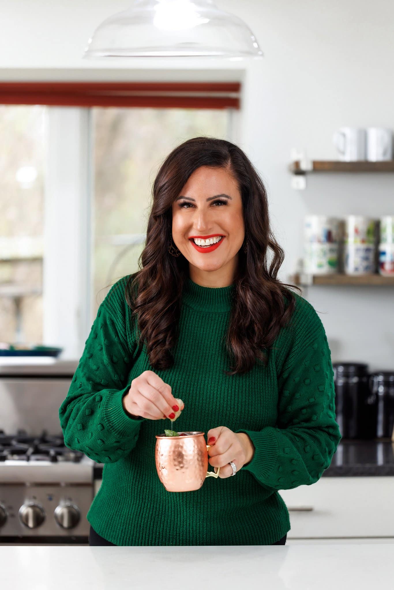 Liz enjoying a pomegranate Moscow mule.