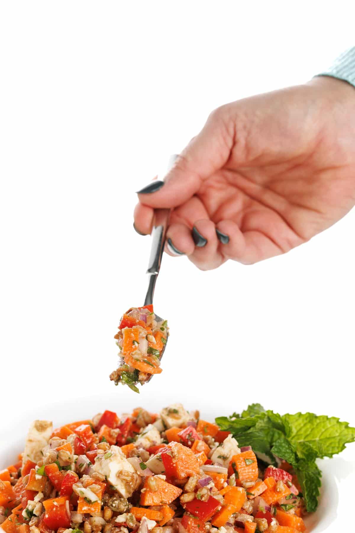 Forkful of wheat berry salad with feta.