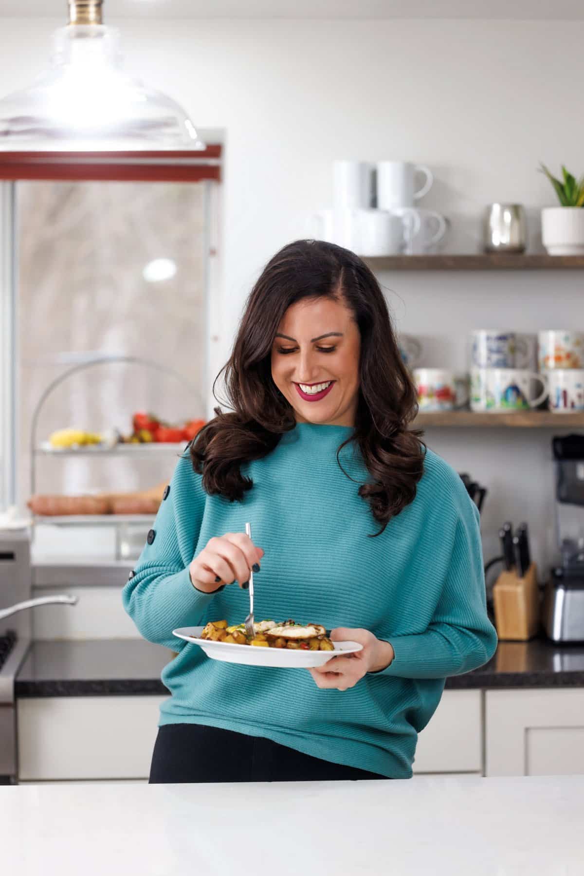 Liz eating vegetable hash breakfast skillet.
