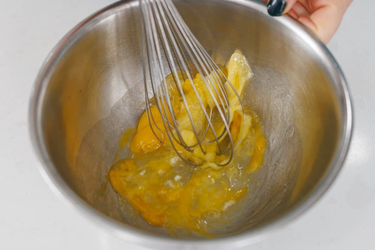 Whisking eggs in a bowl.