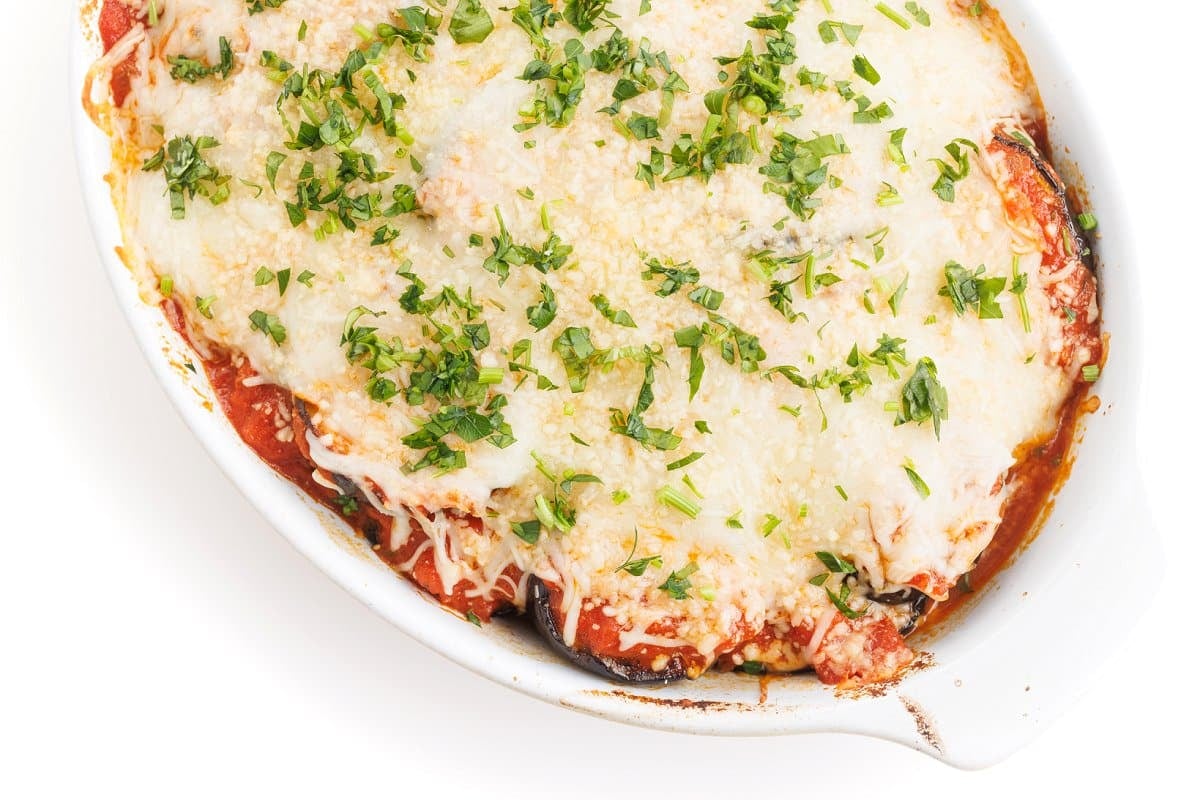 Grilled eggplant parmesan in dish.