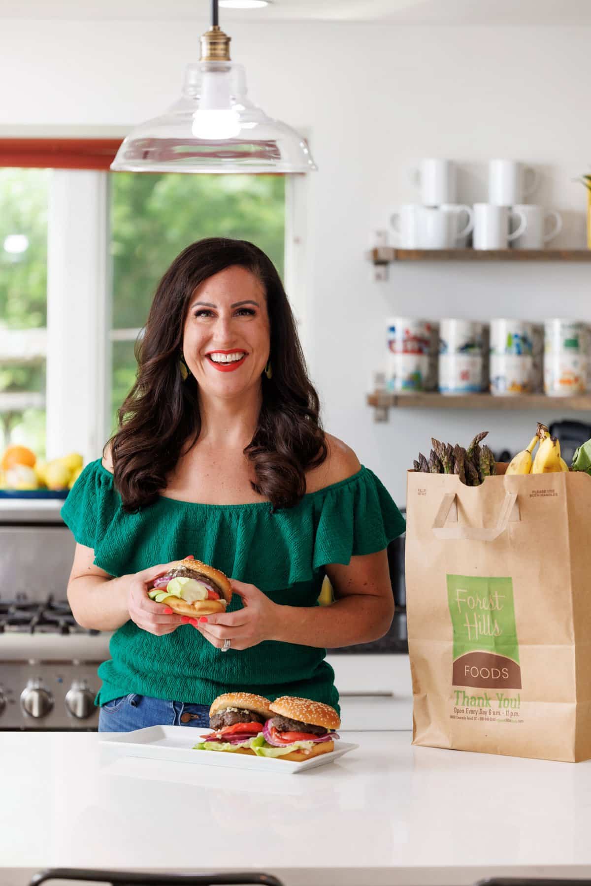 Liz eating blue cheese stuffed burgers.