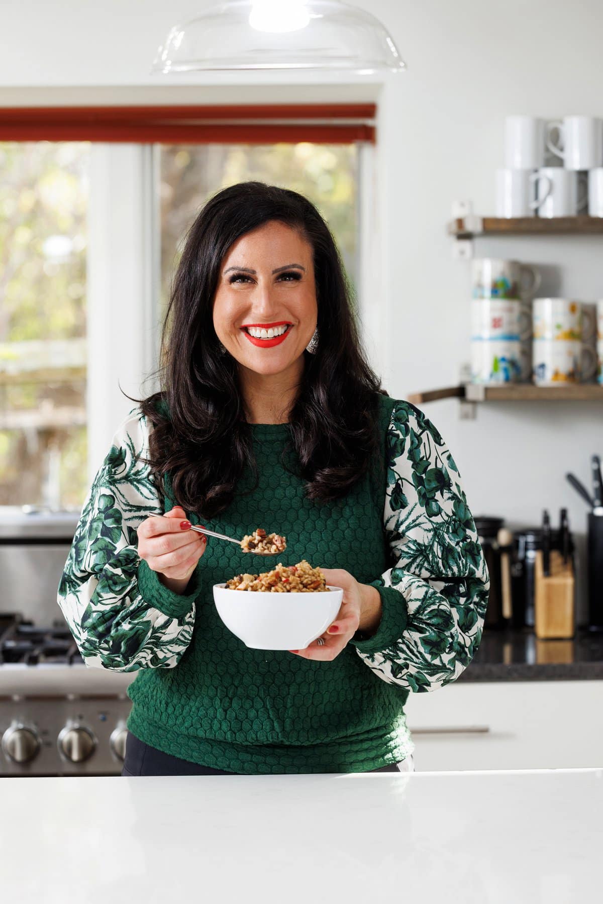 L,iz eating barley breakfast bowl.