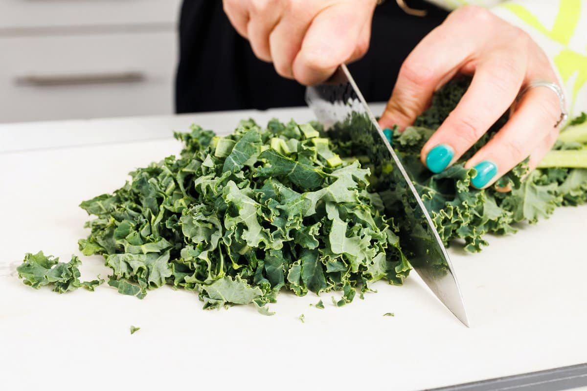Liz chopping kale.
