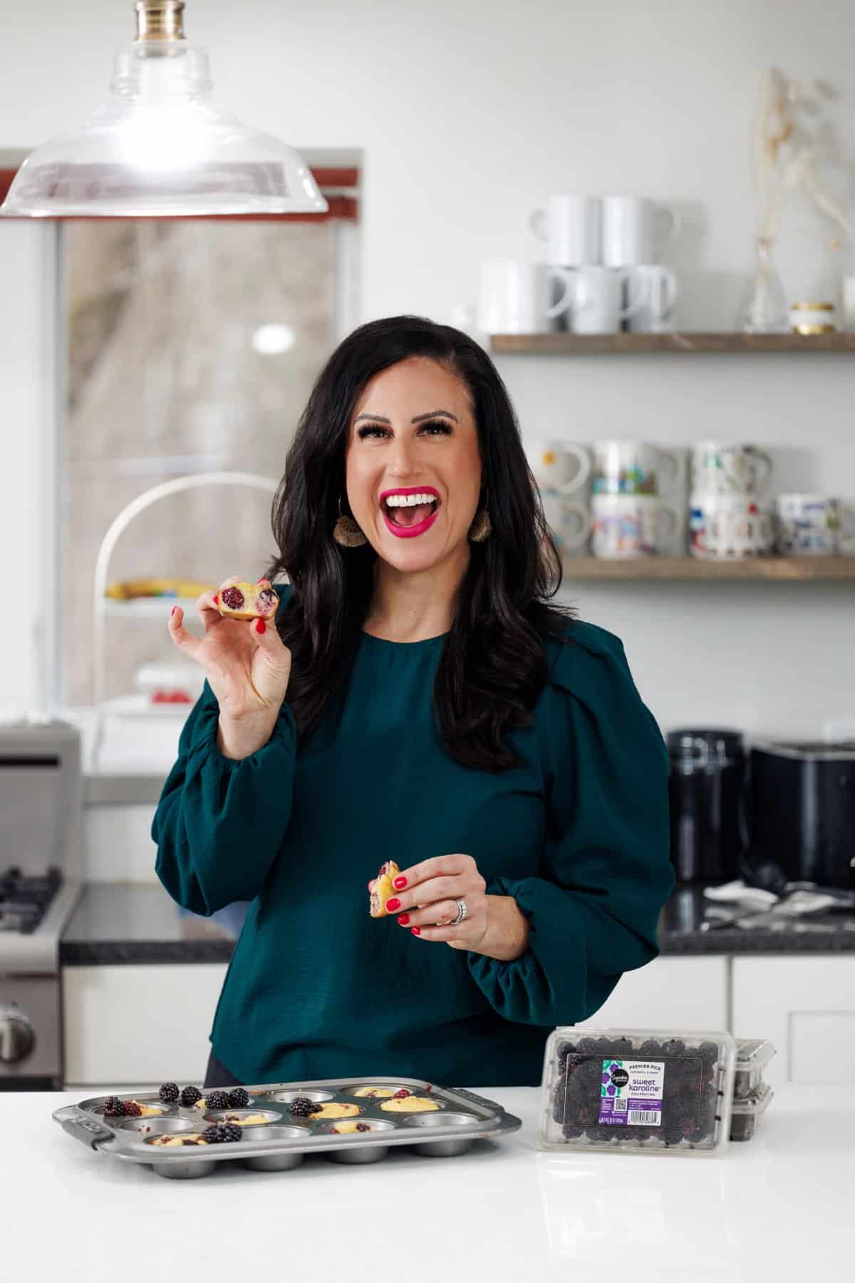 Liz eating almond flour blackberry muffins.