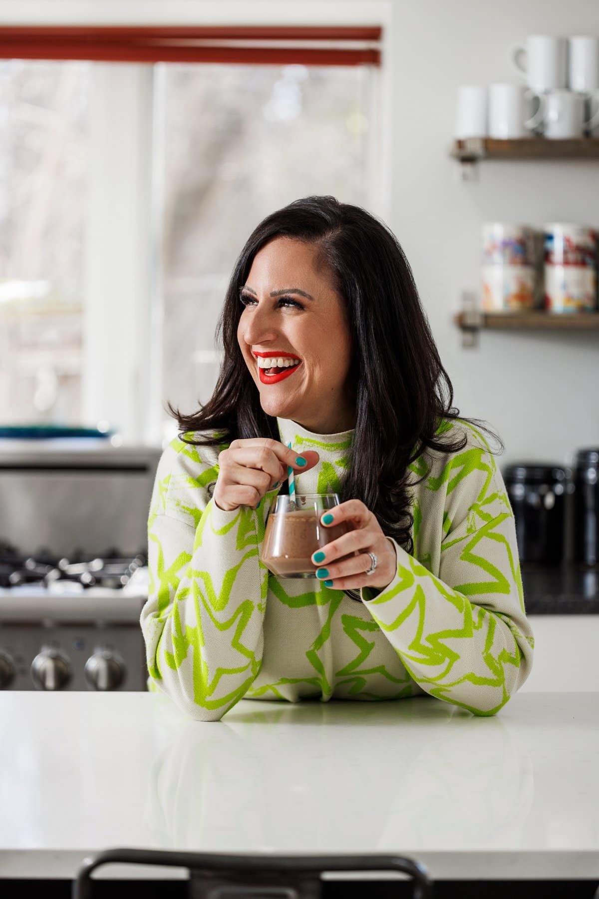 Liz drinking a café mocha smoothie.