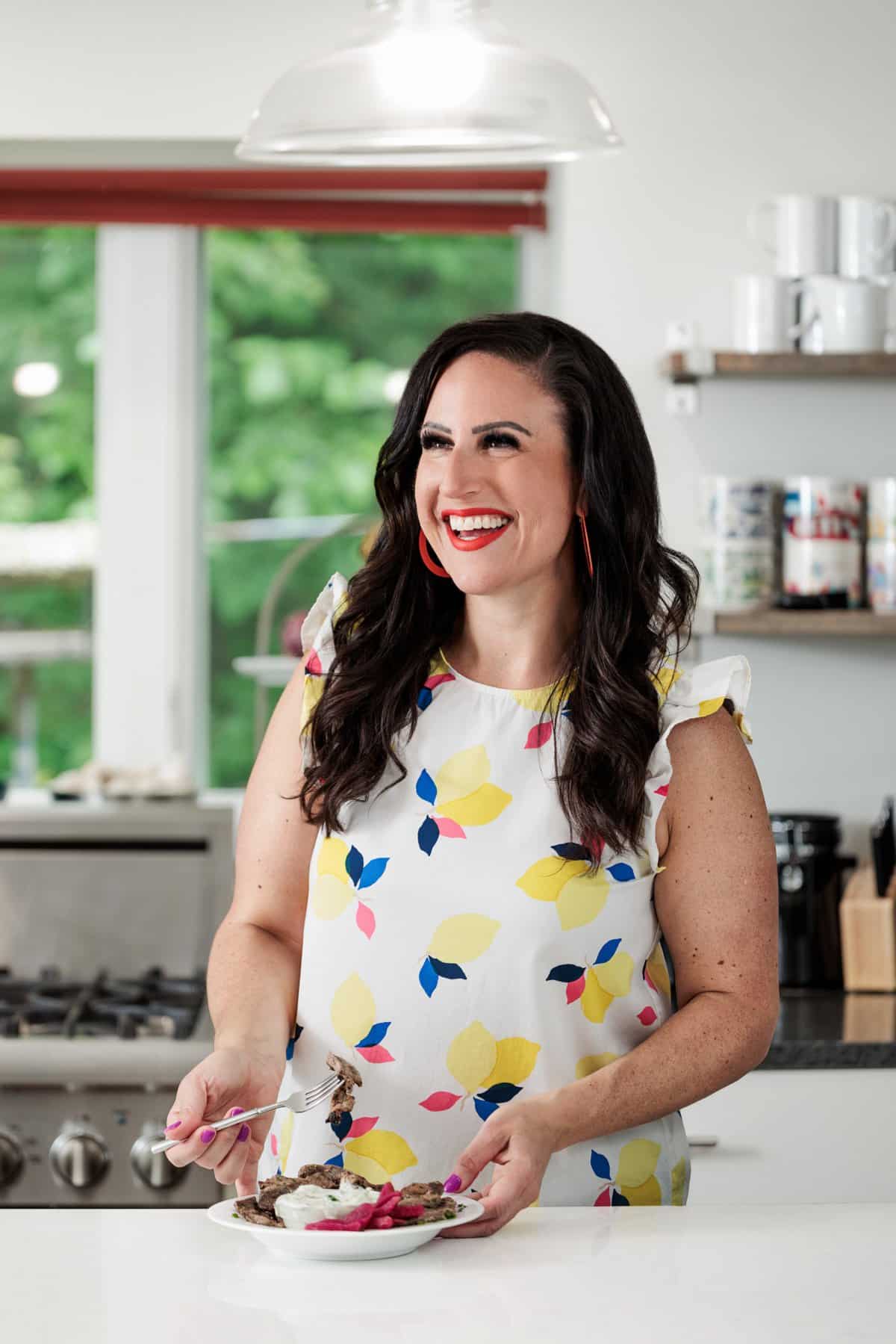 Liz eating beef shawarma with cucumber yogurt sauce.