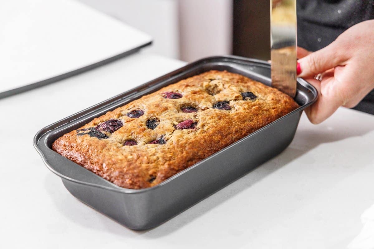 Baked blueberry yogurt bread once out of the oven, still in bread pan.