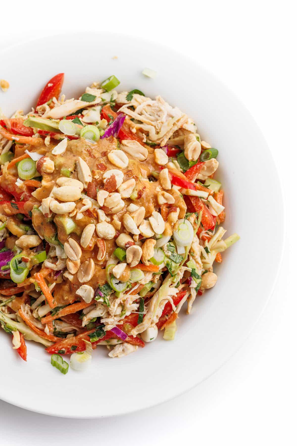 One of 20 high-protein salad recipes, Asian chicken chopped salad topped with peanuts.