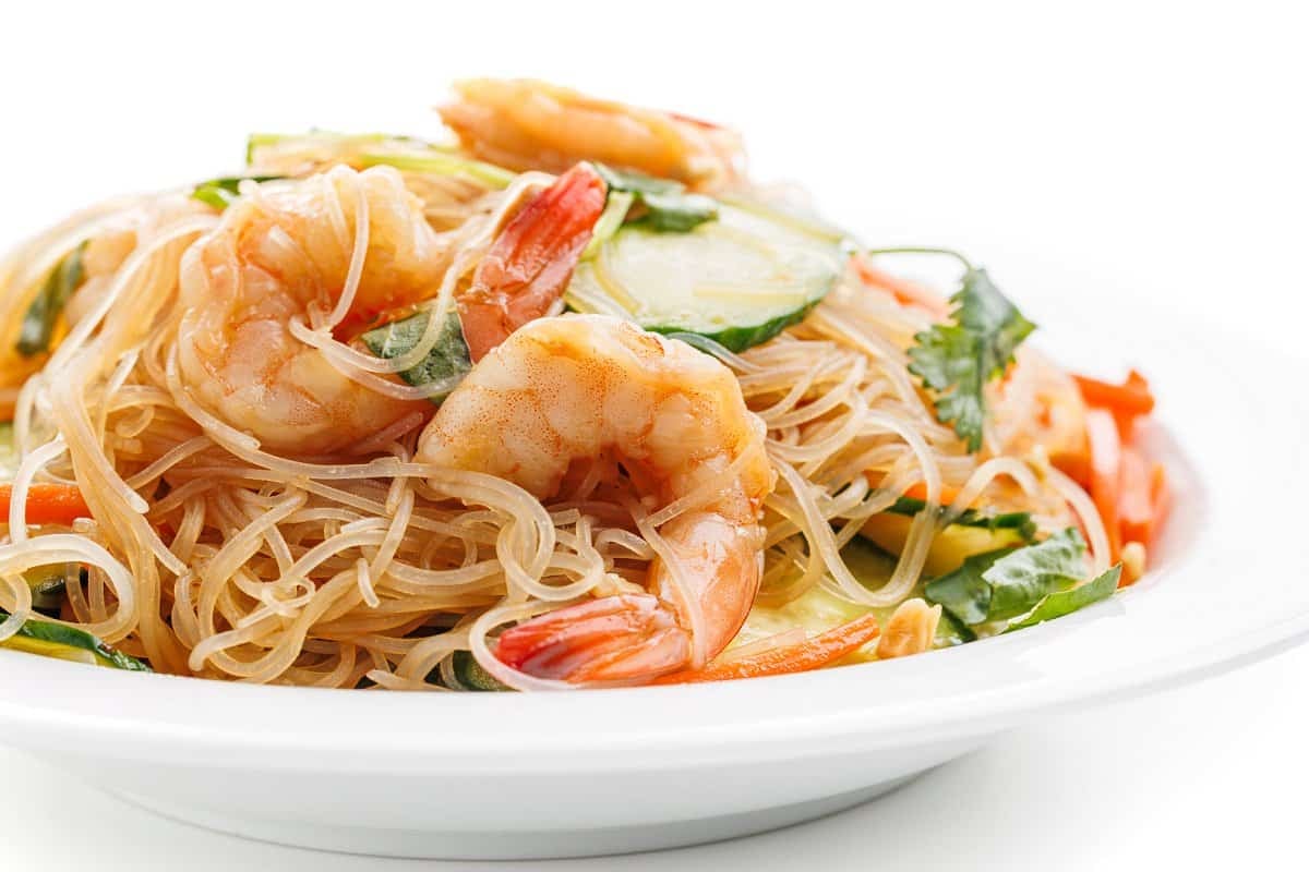 Vietnamese shrimp noodle bowl tossed together on a plate.
