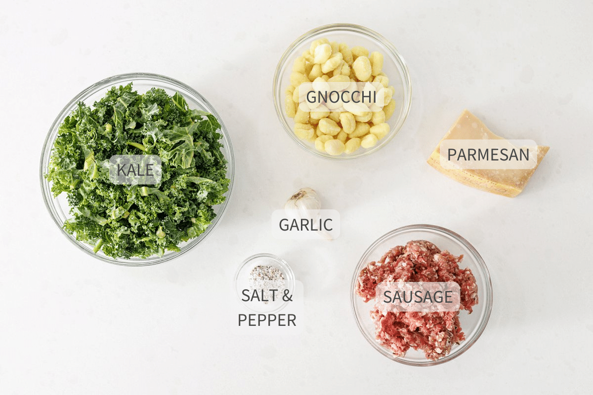 Labeled ingredients of sausage and kale gnocchi pasta.
