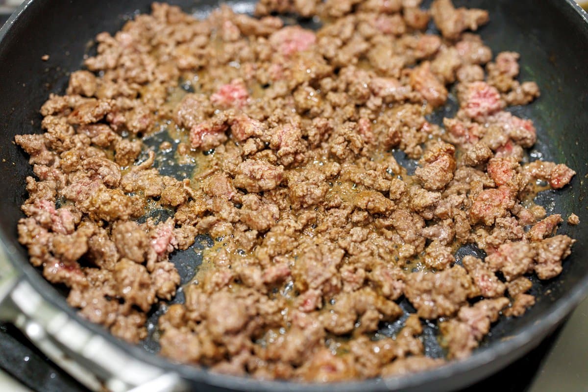Browning ground beef in a skillet.