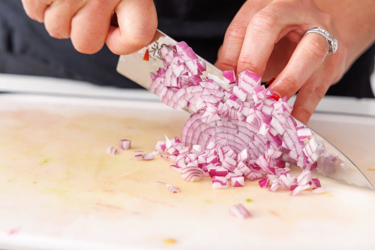 Liz dicing red onion.