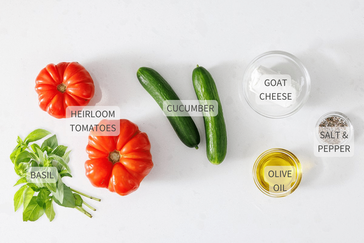 Labeled ingredients for heirloom tomato and cucumber salad.