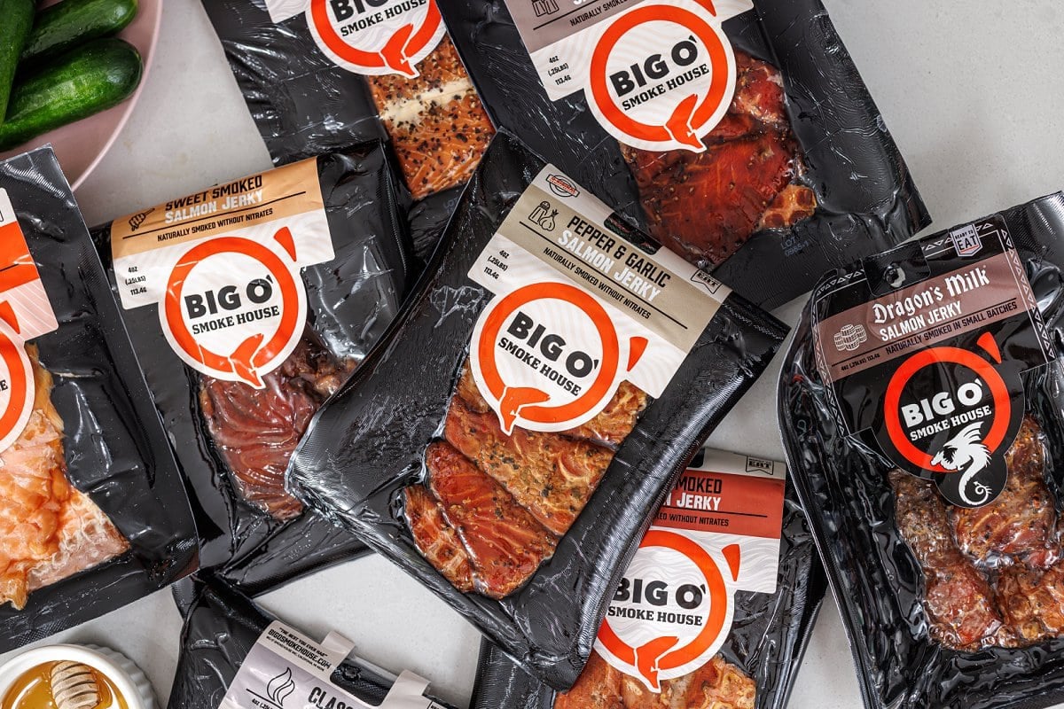 Packages of Big O' Smokehouse smoked salmon jerky in a variety of flavors.