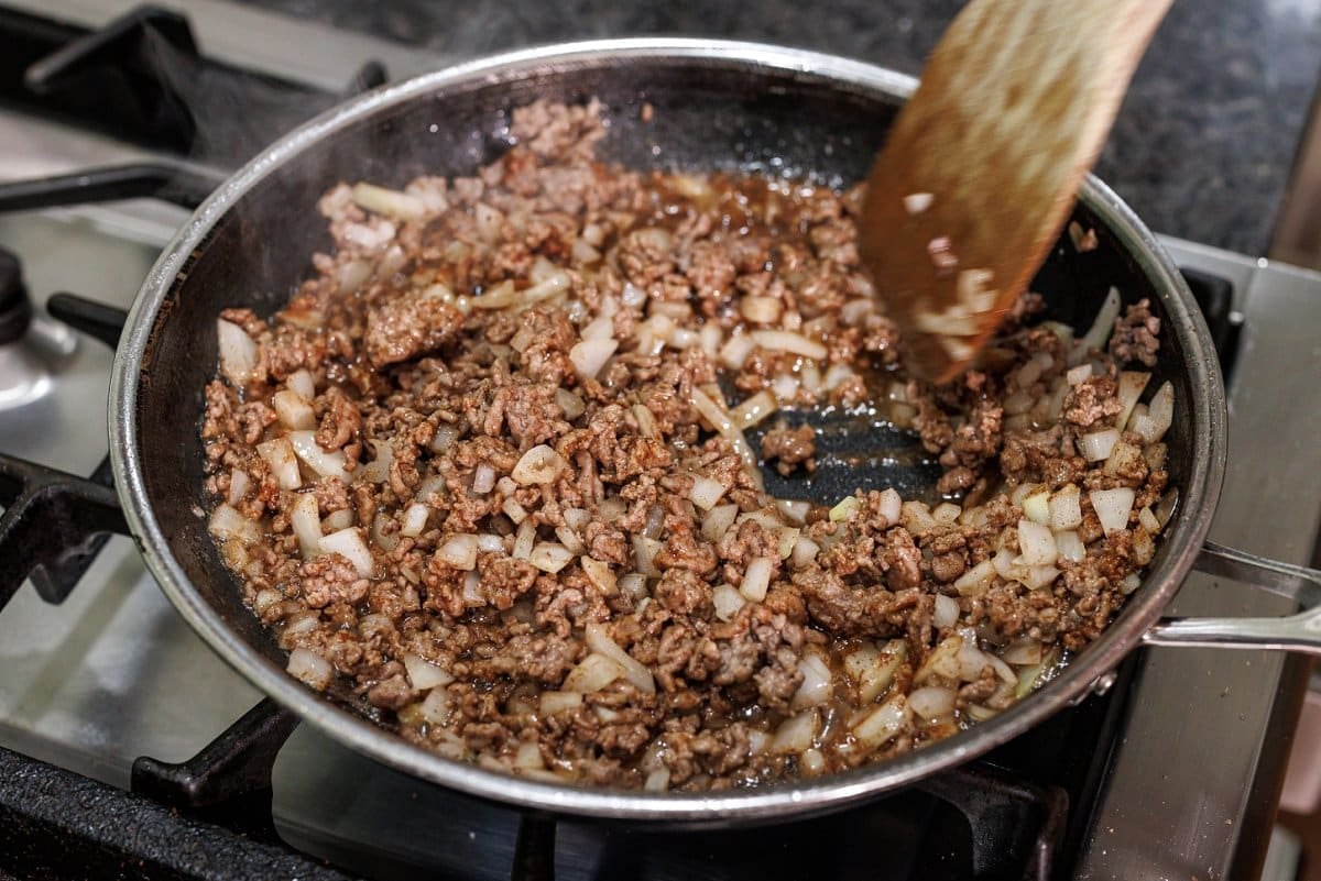 Cooking ground lamb and onion.