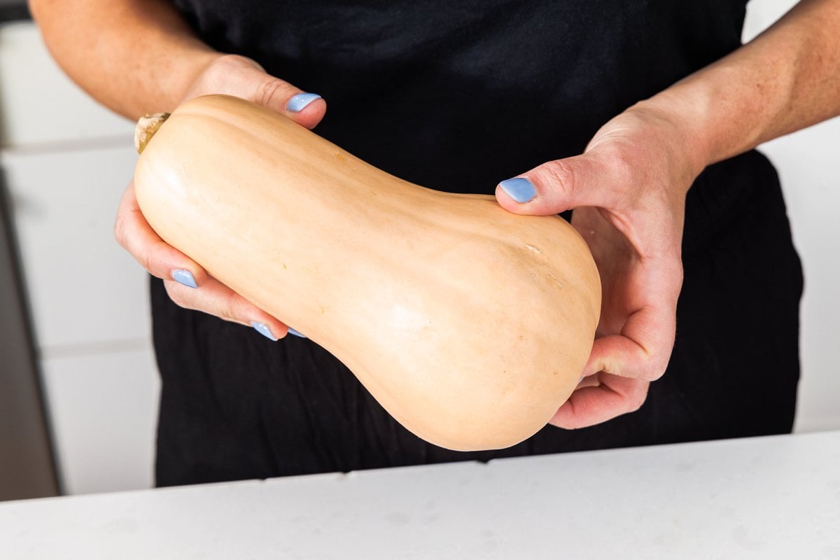 Holding butternut squash.