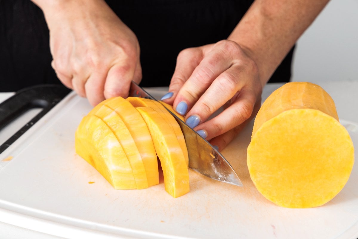 Slicing peeling butternut squash.