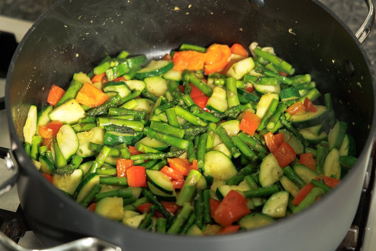 Sautéing veggies in oil and garlic.